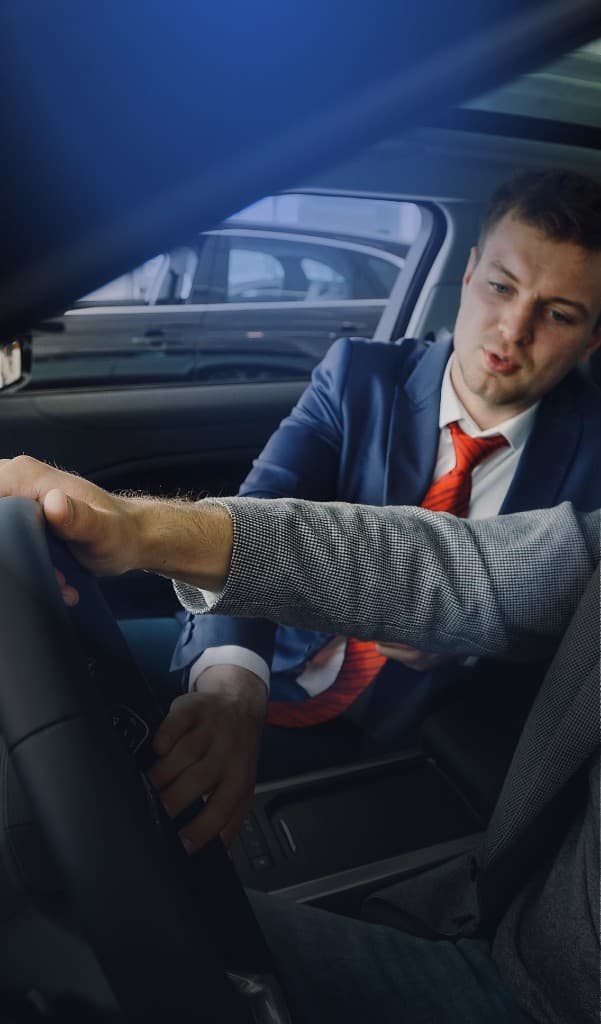 Buyer and seller reviewing a vehicle